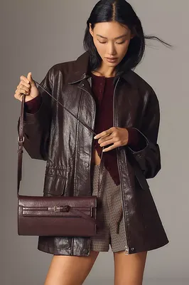 By Anthropologie Cinched-Waist Faux Leather Jacket in black — Autumn black